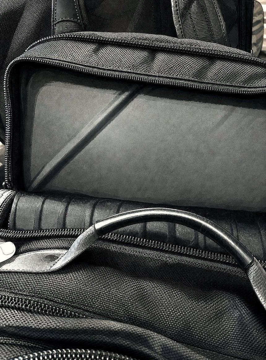 The insert seated inside an open laptop compartment
